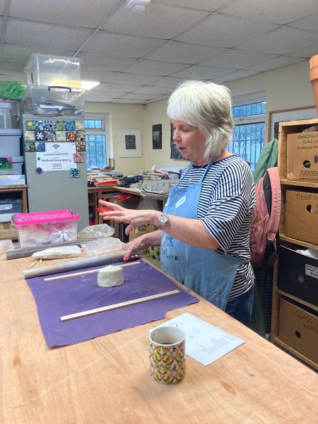 Demonstration - rolling out clay for tiles