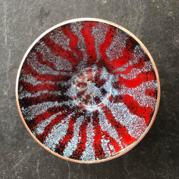 Stunning red and blue enamelled bowl made by Karin on our enamelling copper bowls day course