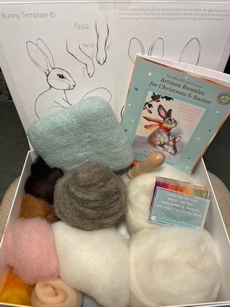 Contents of complete kit, including 100% wool eco mat, Needle tool, needles, Printed Template with three three sizes of bunny, over 135 grams of wool so you can make your very own perfectly proportioned Wild Rabbit, Snow Hare and  micro baby bunny for the Christmas tree or hidden within an Easter egg basket. 