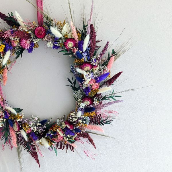 close up of a purple and pink dried flower wreath