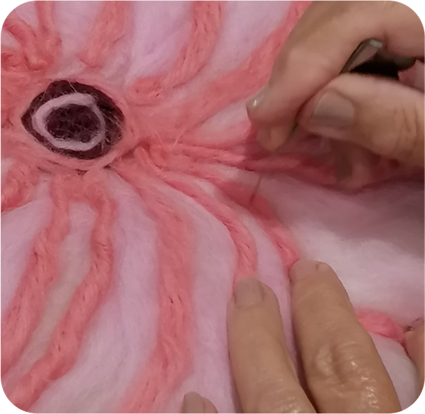 adding needle-felted embellishment