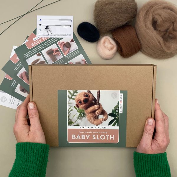 Baby Sloth Needle Felting Kit box cover with wool and instruction cards