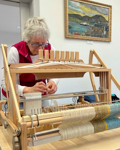 Threading the loom.