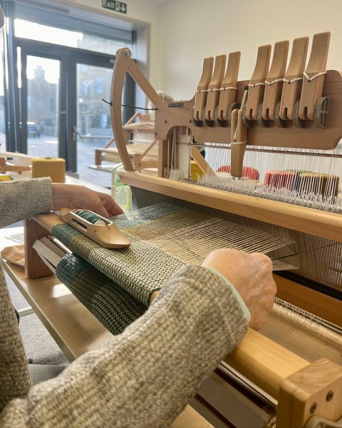 Weaving on our Ashford table looms.