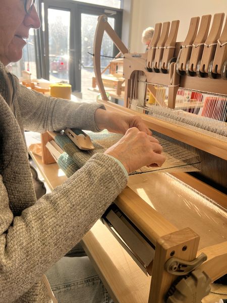 Weaving on the loom.