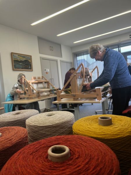 The group weaving their projects.