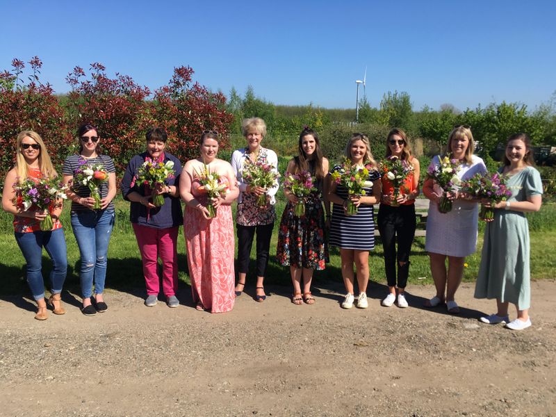 Attendees with their bouquets