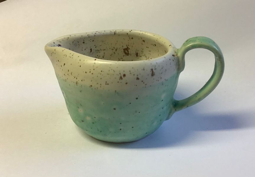 milk jug with speckle low stone glaze. Couple's throwing.