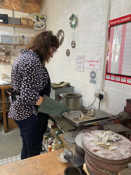 Pouring pewter into a mould
