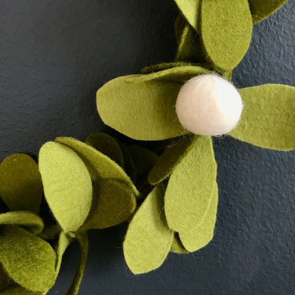 Close up of  large mistletoe berry and leaves