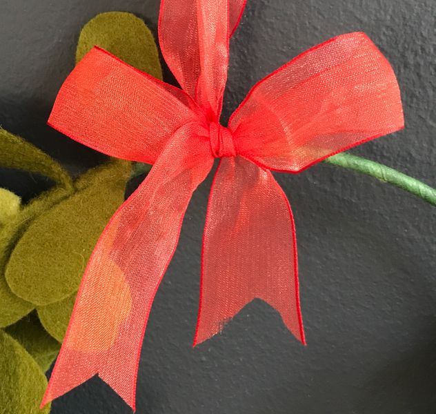 Close up of red organza ribbon bow
