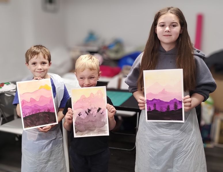 Children are happy with their paintings 