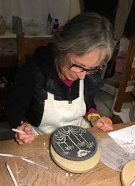 Sgraffito on slabbed plate