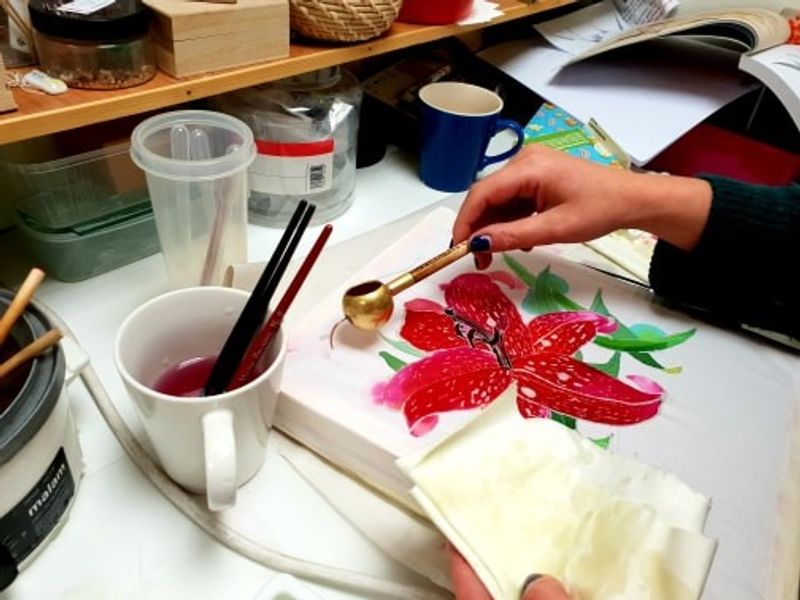 A traditional Batik Tjanting tool is used to draw designs with hot wax.