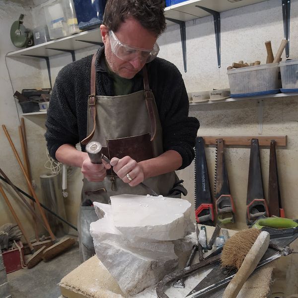 Howard working on an alabaster abstract sculpture on a weekly class at The Stone Carving Studio