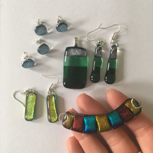 A little collection of student makes dichroic pendants and earrings