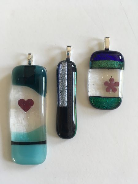 Previous student makes, pendants with metal inclusions