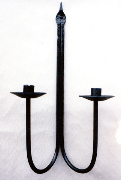Iron worked candlestick by tutor and artist blacksmith Julian Wadsworth in Huddersfield Yorkshire