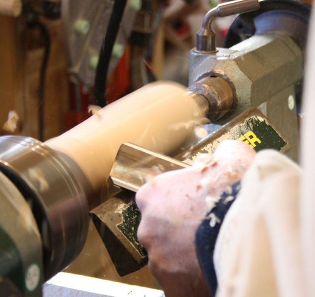 Turning wood on the lathe.