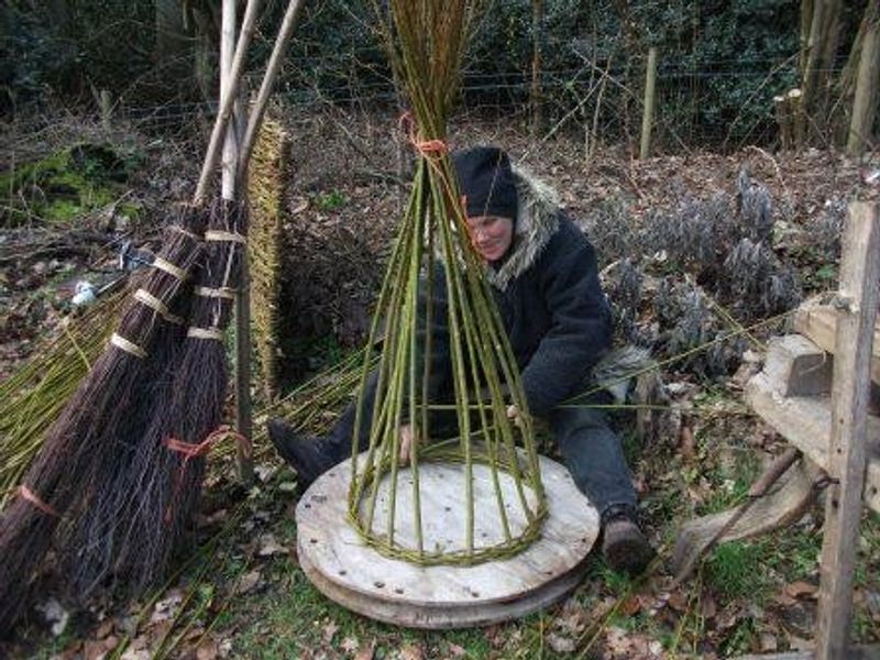 Weaving Willow for a 'Living Willow Seat' on the Willow garden Structures course at the JG Graves, Woodland Discovery Centre