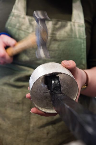 Plannishing the silver whisky tumbler. [Photo Credit: Ben Boswell]