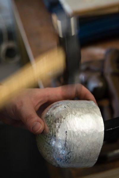 Plannishing the silver whisky tumbler. [Phot Credit: Ben Boswell]
