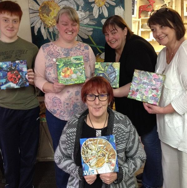 Participants with their finished work from the mixed media taster workshop.