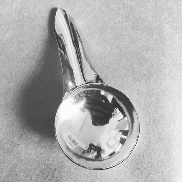 Silver fabricated spoon. Formed bowl attached to forged and shaped handle.