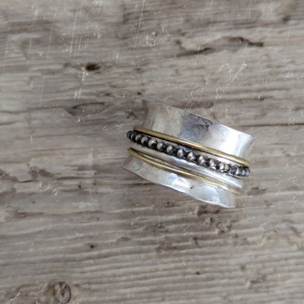 Student spinner ring with added brass wire