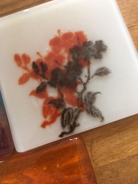 sifted frit and stencils to make a coaster