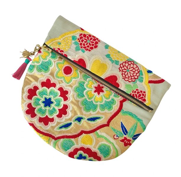 Vintage kimono clutch bag with bug tassel. Red, yellow & green and hand-woven in the UK.