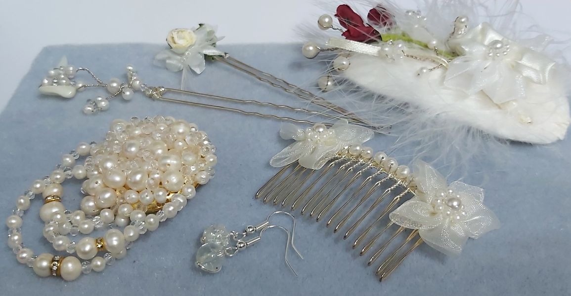 Totally unique creations of a Brooch created in pearl and faceted beads with gold rondells with diamanties.