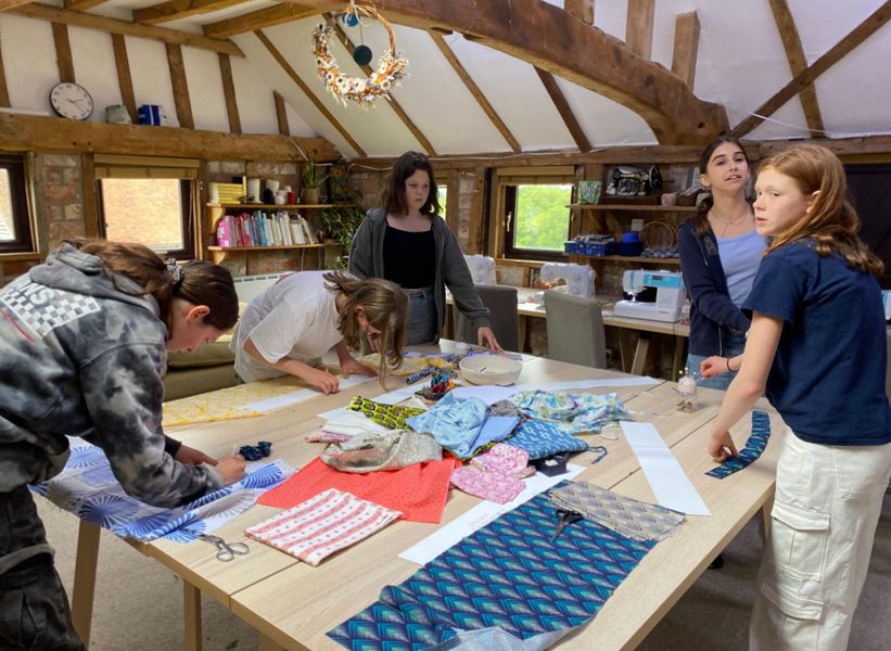 Summer Craft Day - cutting out fabric for scrunchies in preparation for sewing on machine (older children)