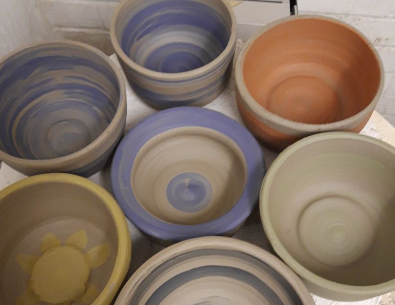 Thrown pots by students attending throwing classes.