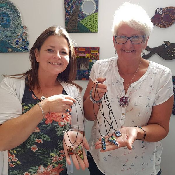 Happy students with their finished pendants