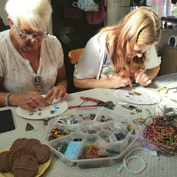 Students busy at work amongst beads and biscuits!