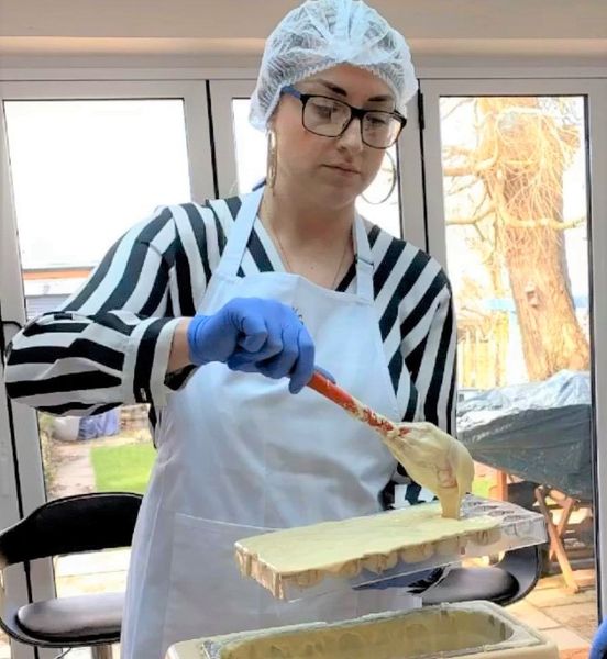 Bride to be filling chocolate moulds