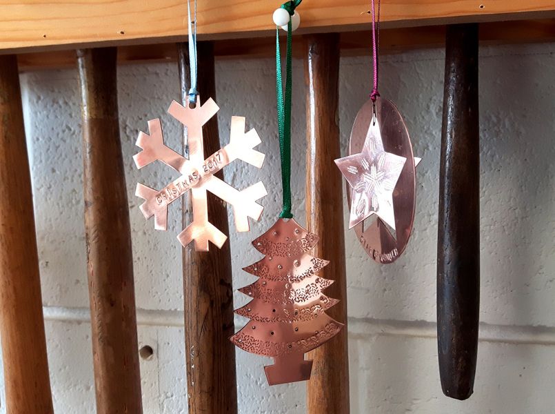 (DEMO) Hand pierced, copper Christmas decorations.