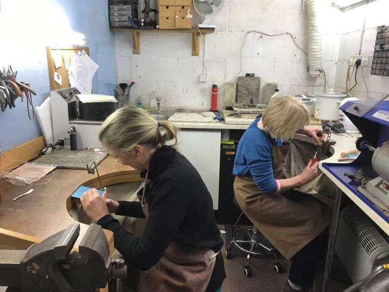 Mother & daughter using a fretsaw