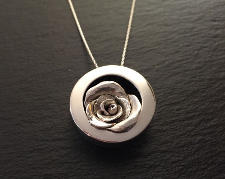 Silver framed rose pendant