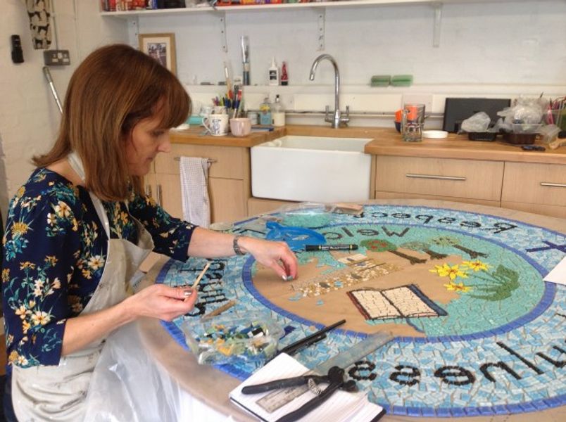 Jackie working on a mosaic