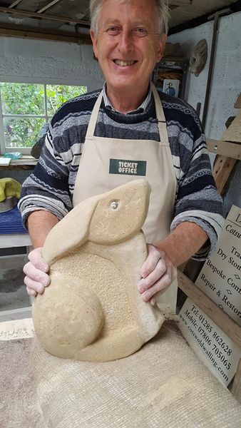 Proud first time carver Peter shows off his beautiful hare carving