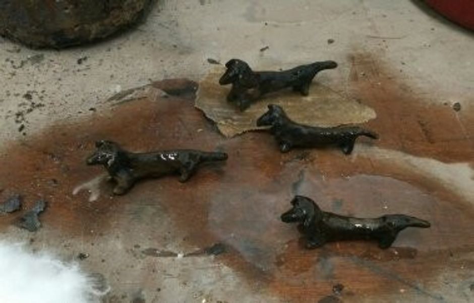 A litter of tiny bronze dachshunds