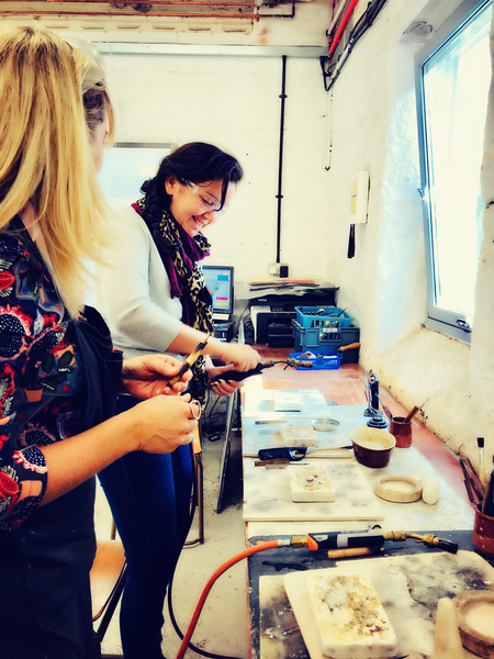 Student learning to solder with Rachel Hearne