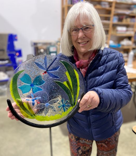 Gill with her fused glass garden art