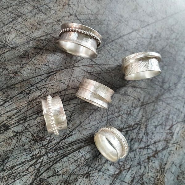 Just a few of the rings made on a spinner ring workshop