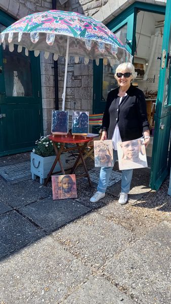 A happy student with the fruits of her two-day photoencaustic workshop