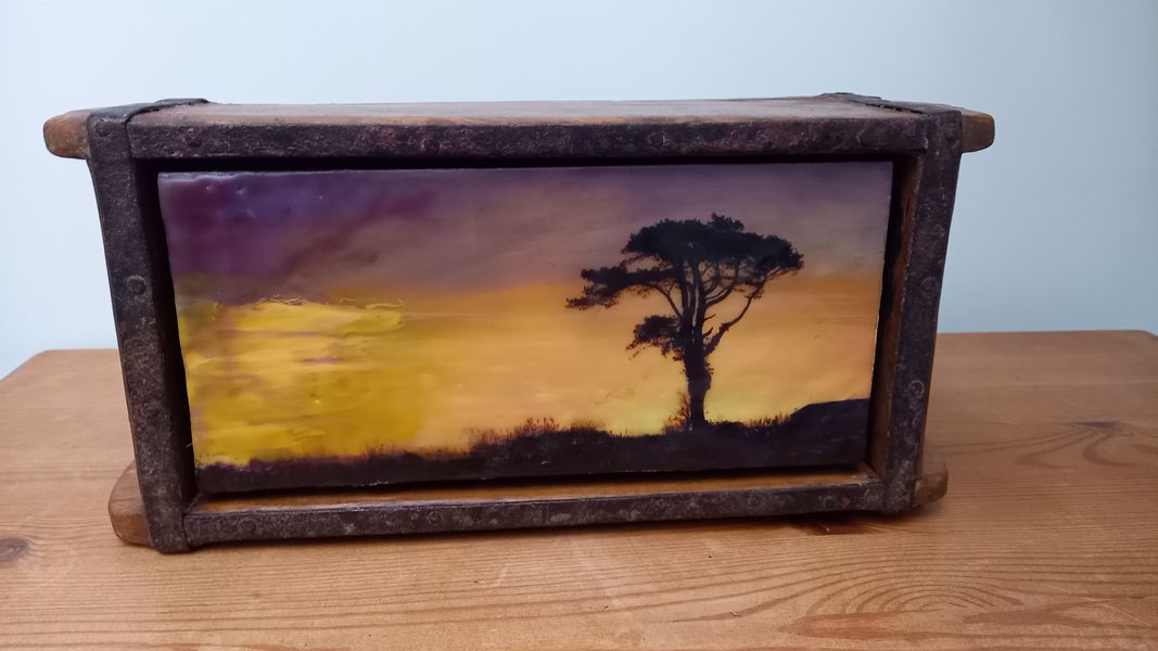 Using an antique wooden container to create a unique table-top photo-encaustic piece.