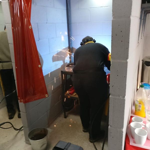 A student immersed in his work in our professionally bespoke welding bays