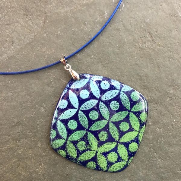 Graduated enamel adds character to this lovely patterned enamel pendant